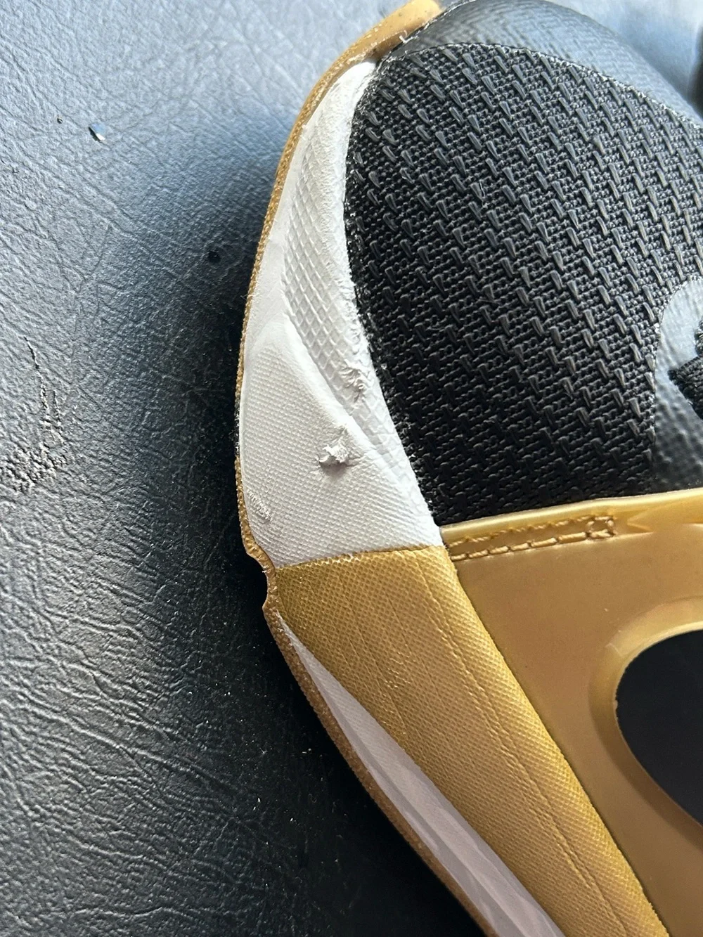 Nike Kids Black and Gold Sneakers